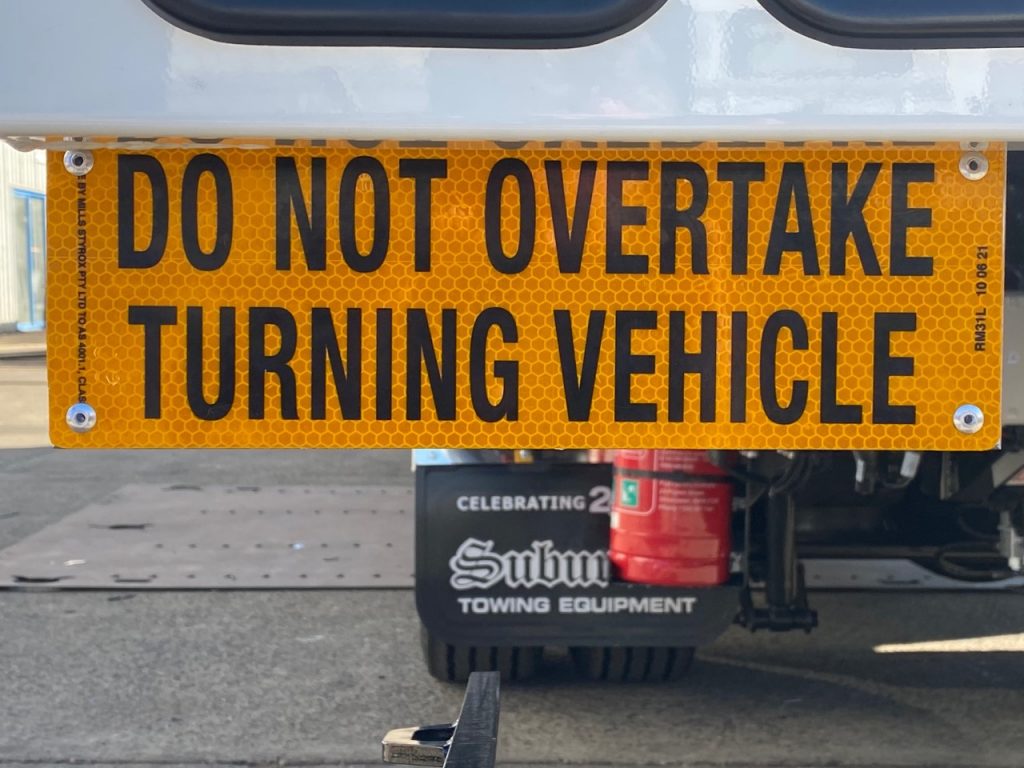 DO NOT OVERTAKE TURNING VEHICLE